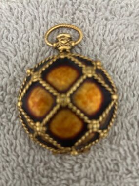 Solid perfume compact. No makers name.